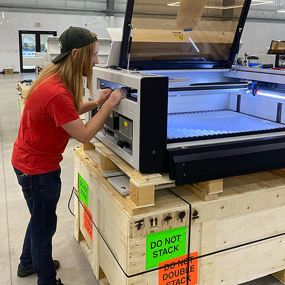 an Aeon technician working on inspecting a machine